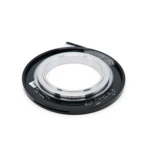 Close-up of a camera lens with focus ring and aperture control for photography.